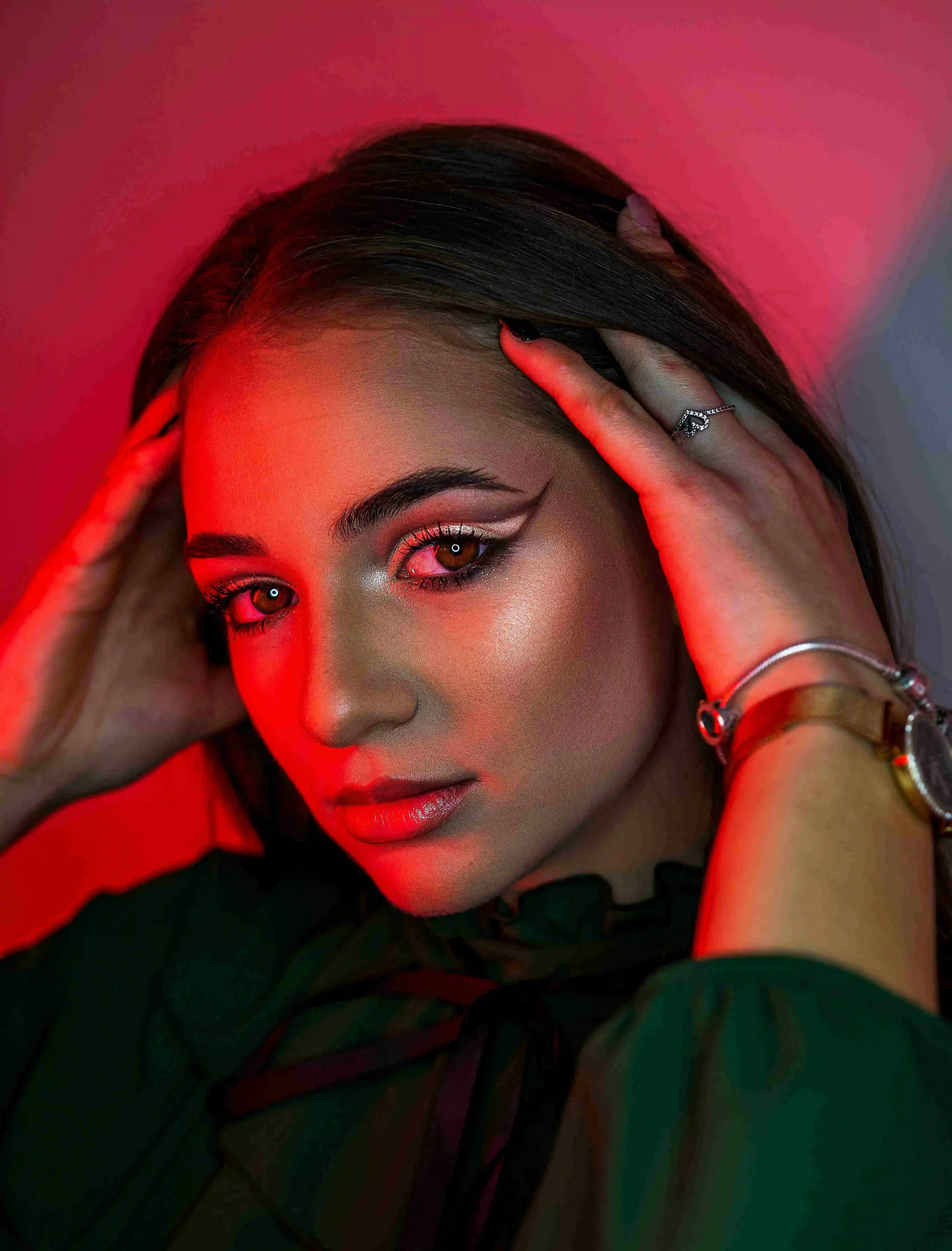 Bold beauty portrait with red dramatic lighting for fashion editorial